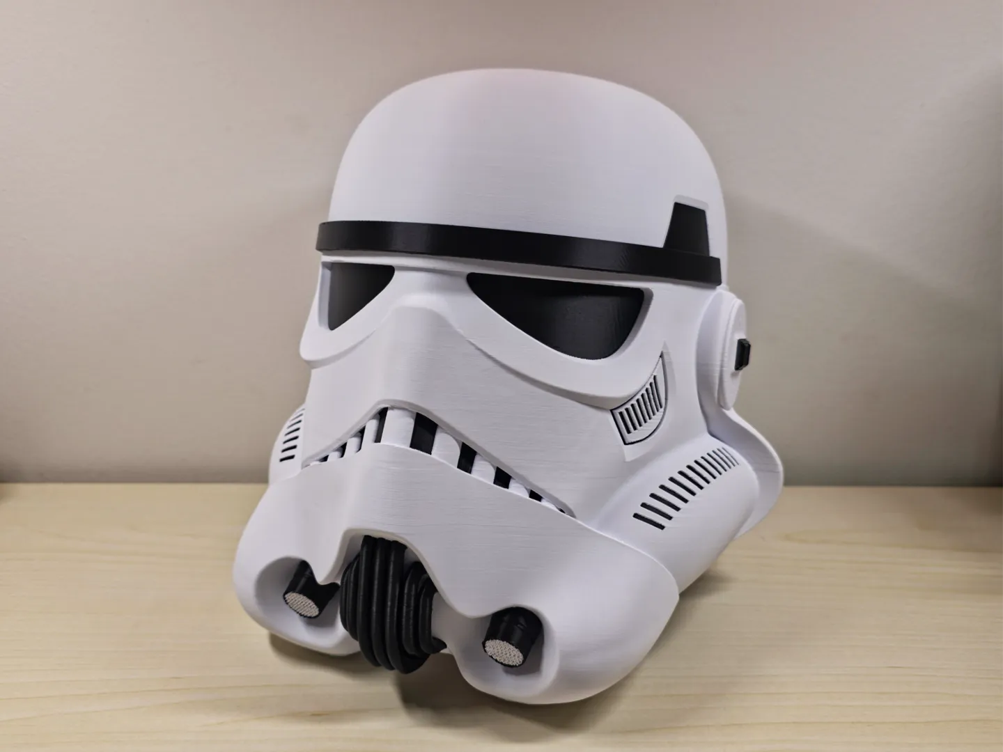 White and black 3D-printed stormtrooper helmet shown from an angle